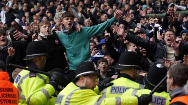 Fans invading the pitch clash with police officers during the Emirates FA Cup fourth round match at The Hawthorns, West Bromwich. Picture date: Sunday January 28, 2024.</p>

<p>　　