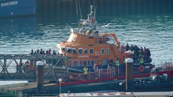 A group of people thought to be migrants are brought in to Dover, Kent, o<em></em>nboard the Ramsgate Lifeboat following a small boat incident in the Channel. Picture date: Thursday August 10, 2023