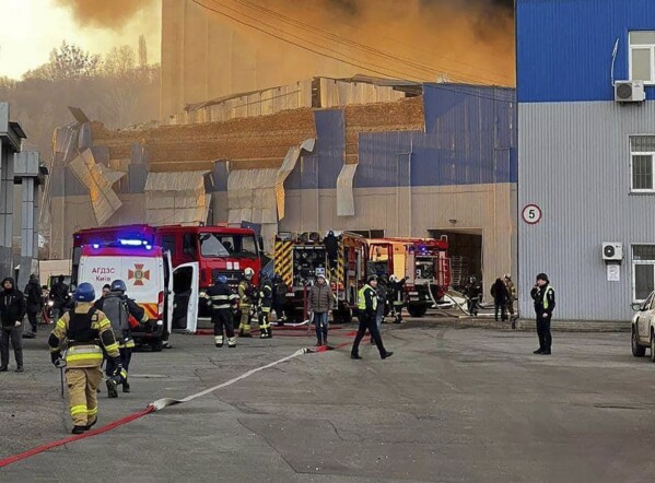 In this photo provided by the Ukrainian Emergency Service, firefighters work on a site of a building damaged after a Russian attack in Kyiv, Ukraine, Friday, Dec. 29, 2023. (Ukrainian Emergency Service via AP)