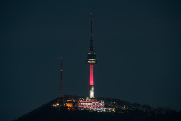 The N Seoul Tower in Yongsan-gu, central Seoul is lit up in sky coral, the 