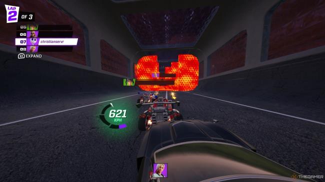 A screenshot from Fortnite's Rocket Racing mode showing three cars colliding with each other in a skewed line, with sparks flying. Red obstacles can be seen in the distance.