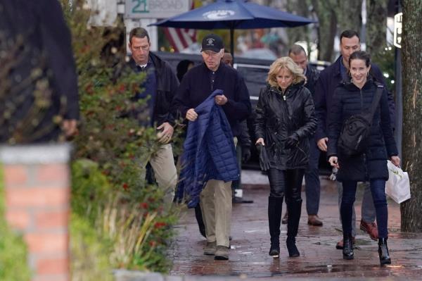 President Joe Biden and first lady Jill Biden walk with their daughter Ashley Biden after havin<em></em>g lunch at Brotherhood of Thieves in Nantucket, Mass