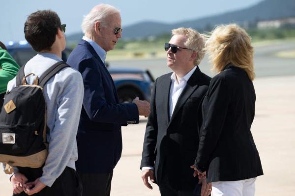 President Joe Biden greets Bill and Co<em></em>nnie Neville whose home they stayed at as they board Air Force One prior to departure from Henry E. Rohslen Airport in Christiansted, St. Croix in the US Virgin Islands, on January 2, 2023.