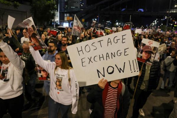 Families and supporters of hostages hostages held by Palestinian militants since the October 7 attack hold a demo<em></em>nstration outside the Israeli ministry of defence in Tel Aviv.