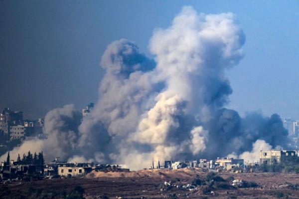 smoke rising from buildings after being hit by Israeli strikes