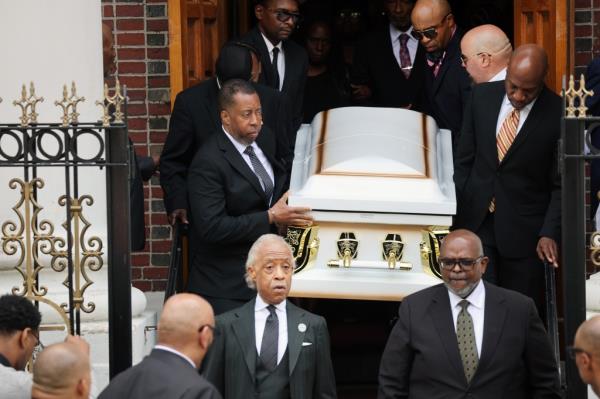 Jordan Neely's casket being walked out of the church.