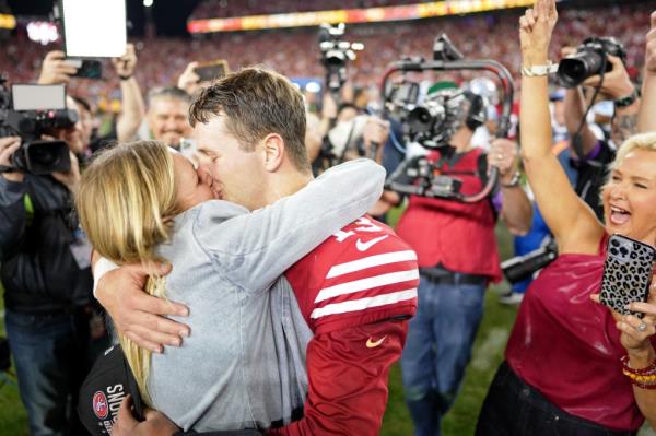 San Francisco 49ers quarterback Brock Purdy (13) kisses his fiance Jenna Brandt after winning the NFC Champio<em></em>nship football game against the Detroit Lions at Levi's Stadium. 