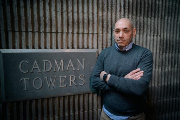 The author in front of Cadman Towers, which spent years — and nearly 100 meetings — debating the merits of embracing the Article 2 to 11 model. 