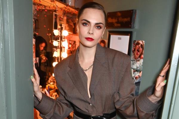 Cara Delevingne in a striped shirt attending the after party for the gala performance of 'Cabaret At The Kit Kat Club' in London, England.