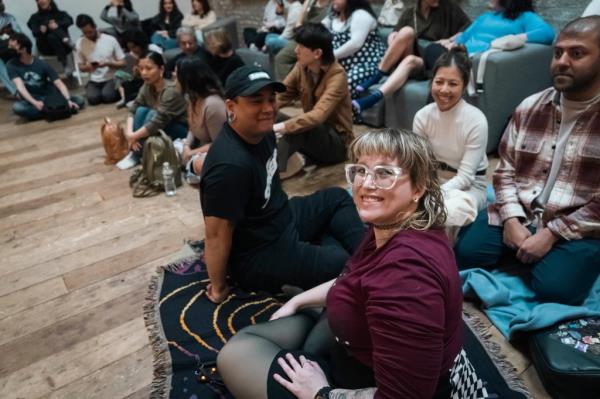 Gaia Music Collective choir performing to an internatio<em></em>nal audience of 180 people seated on the floor, at a vacant space in Gowanus area, Brooklyn NY.