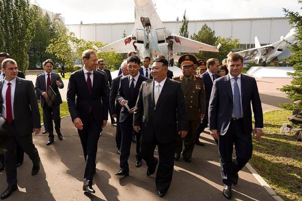 Kim Jong Un, center, listens to Deputy Prime Minister and Minister of Trade and Industry Denis Manturov, center left, while visiting a Russian aircraft plant that builds fighter jets in Komsomolsk-on-Amur, a<em></em>bout 6,200 kilometers (3,900 miles) east of Moscow, Russia.