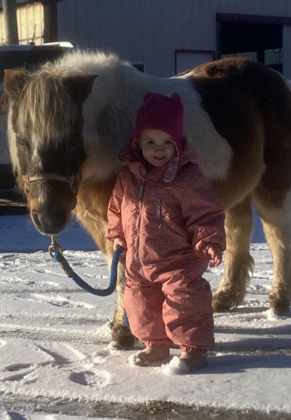 Penny with a small child.