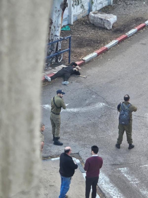 Photos posted to social media in the aftermath showed troops with guns standing near a man lying in the street with a hatchet next to him.