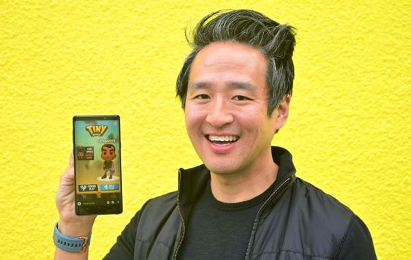 Bernard Kim, President of Publishing at Zynga, presenting the 'Tiny Royale' game on his mobile phone at the Snap Partner Summit in West Hollywood, California