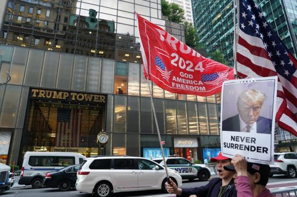 Trump supporters and o<em></em>nlookers gathered outside of Trump Tower after Do<em></em>nald Trump was found guilty in New York, NY on May 30, 2024. 