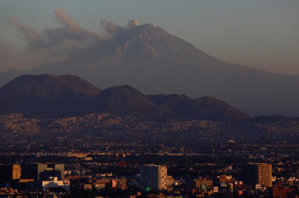 Popocatepetl volcano with steam and ash during sunset in Mexico City, January 24, 2024.