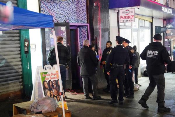 NYPD offocers were seen outside the illegal boarding house.