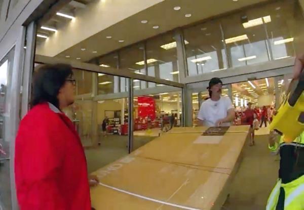 Body camera video shows Berman, dressed in a white t-shirt, wheeling a cart with a stolen LG 65-inch television at a Target store in Atlanta Monday