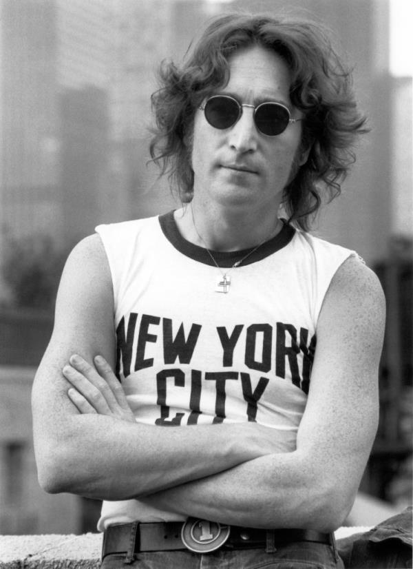 A photo of John Lennon wearing a NYC tee shirt. He posed for the picture on a NYC rooftop in 1974