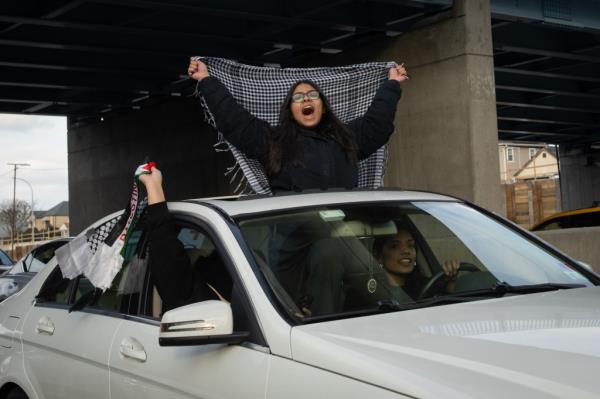 Photo shows a vehicle of protesters in a caravan headed to JFK.