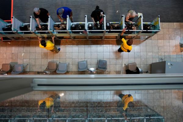 People vote in the Nevada primary at a polling place, Tuesday, June 11, 2024, in Henderson, Nev. (AP Photo/John Locher)