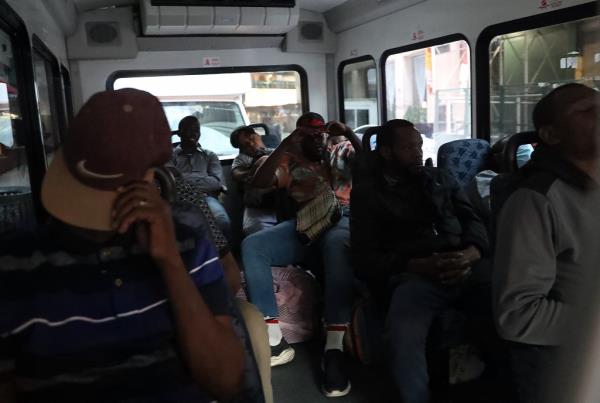 A bus of migrants outside of the Roosevelt Hotel in Manhattan on July 30, 2023.