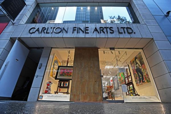 An early morning smash-and-grab at the Carlton Fine Arts Gallery on Madison Ave, by 55th St., NYC. left the glass front door smashed and an empty easel sitting without any artwork. 