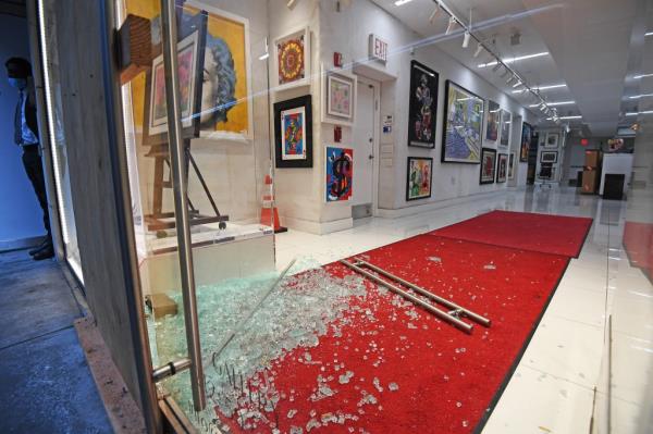 An early morning smash-and-grab at the Carlton Fine Arts Gallery on Madison Ave, by 55th St., NYC. left the glass front door smashed and an empty easel sitting without any artwork. 