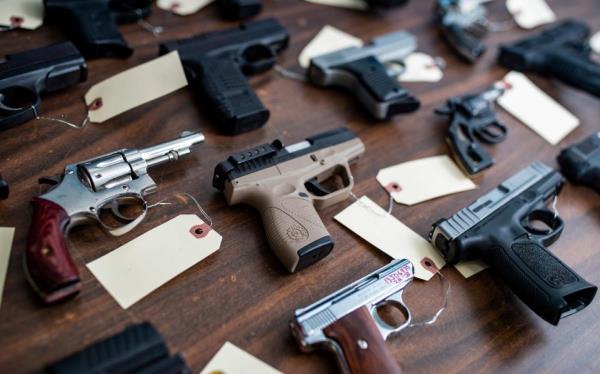 Co<em></em>nfiscated handguns are stored in the Louisville Metro Police evidence room on Industry Road. Dec. 30, 2021