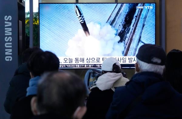 A TV screen shows a file image of North Korea's missile launch during a news program at the Seoul Railway Station in Seoul, South Korea, Sunday, Jan. 14, 2024. 