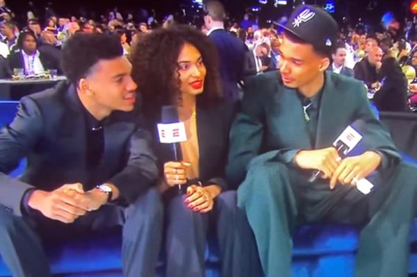 Victor Wembanyama (right) appears on the ESPN broadcast of the 2023 NBA Draft with brother Oscar (left) and sister Eve (center).