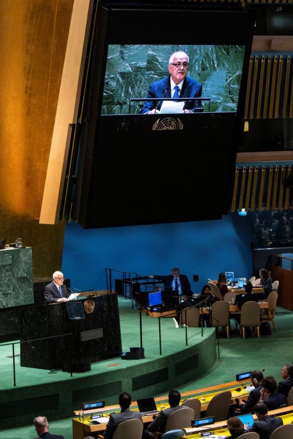 Palestinian Ambassador to the United Nations Riyad Mansour addresses delegates during the United Nations General Assembly before voting.