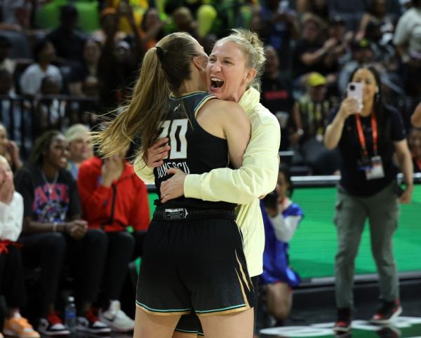 Sabrina Io<em></em>nescu #20 of the New York Liberty hugs her Liberty teammate Courtney Vandersloot #22.