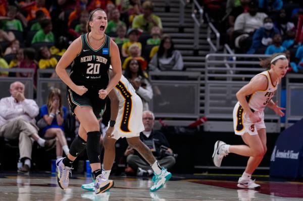 Sabrina Io<em></em>nescu (20) celebrates a three-point basket against the Indiana Fever.