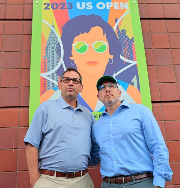 Gary Falkowitz (right) and Mitchell Hassenbein (left) pose for a photo outside Arthur Ashe Stadium, wher<em></em>e their late sons were ho<em></em>nored Monday. 