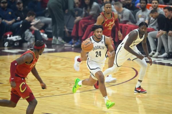 Nets guard Cam Thomas brings the ball up court in the first quarter against the Cleveland Cavaliers at Rocket Mortgage FieldHouse.