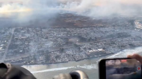 An aerial photo shows the decimated coastal neighborhoods that were burnt to the ground. 