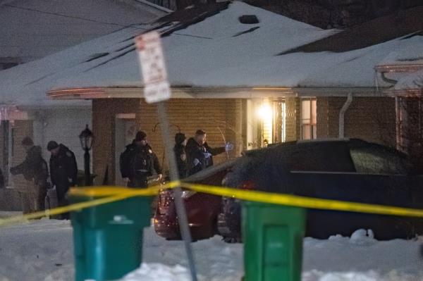 Police are pictured investigating the shooting in Joliet on Monday.