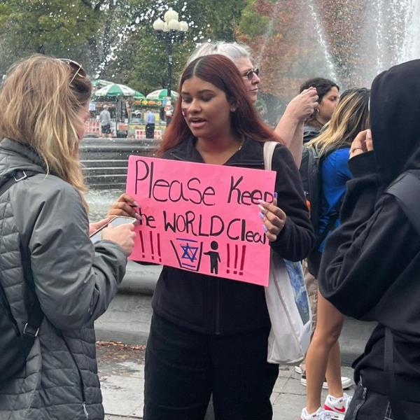 Woman with sign saying 