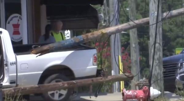 The knocked down utility pole is shown after the trailer rammed into it. 