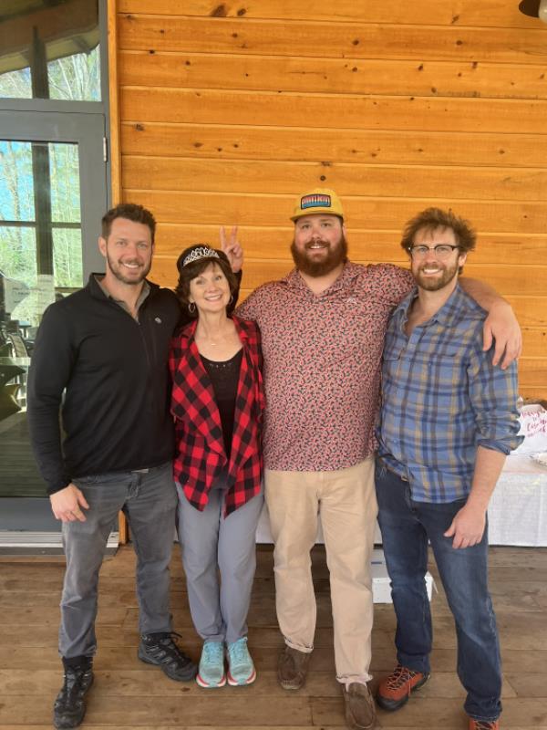 Johnny Wactor posing with his mother Scarlett and brothers Grant and Lance at a surprise 60th birthday party