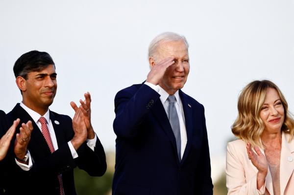 Biden salutes during the demonstration.