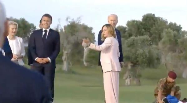 Biden pulled back by Italian PM Giorgia Meloni.