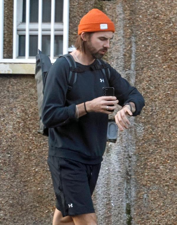 Emily Atacks boyfriend Dr Alistair Garner seen leaving their house the day after it was announced they are due to have their first baby together.