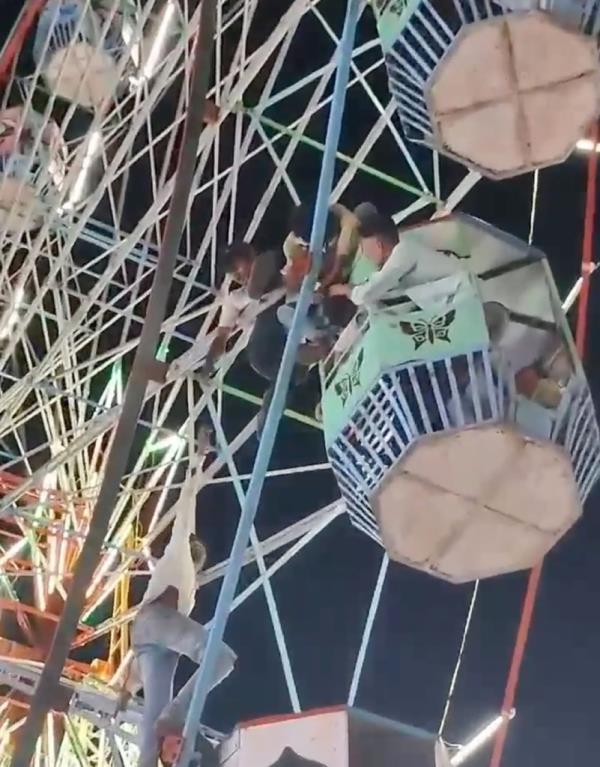 Carnival staff had to climb the ride to free the woman.