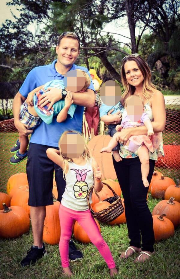 Nick Davenport, 45, is pictured with wife Amy and their four young children