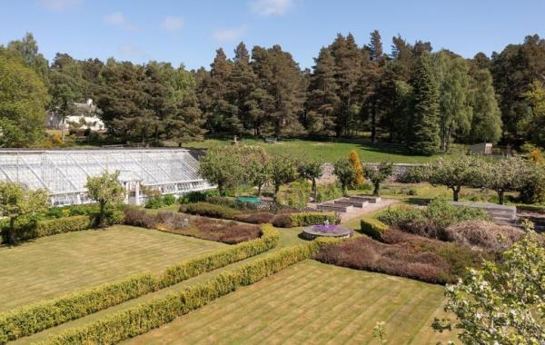 The greenhouse and gardens.