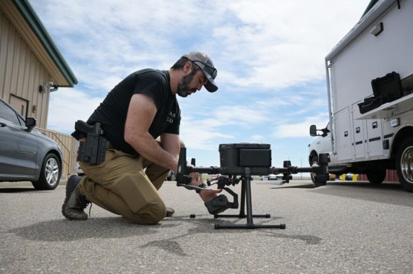 Dep. Jamie Foster of Arapahoe County Sheriff's Department assembles the drone during the training at Arapahoe County Fairgrounds in Aurora, Colorado on Tuesday, May 14, 2024.