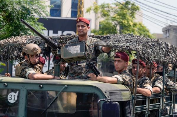 Lebanese special forces sit in their vehicle as they patrol on a road that leads to the U.S. Embassy in Aukar, a northern suburb of Beirut, Lebanon, Wednesday, June 5, 2024.