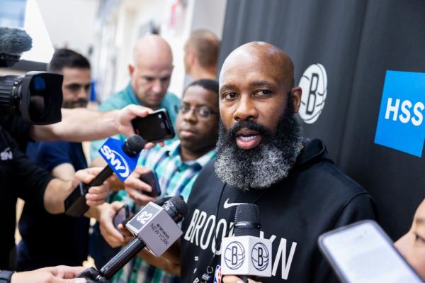 Nets coach Jacque Vaughn speaks to the media during a training camp practice.